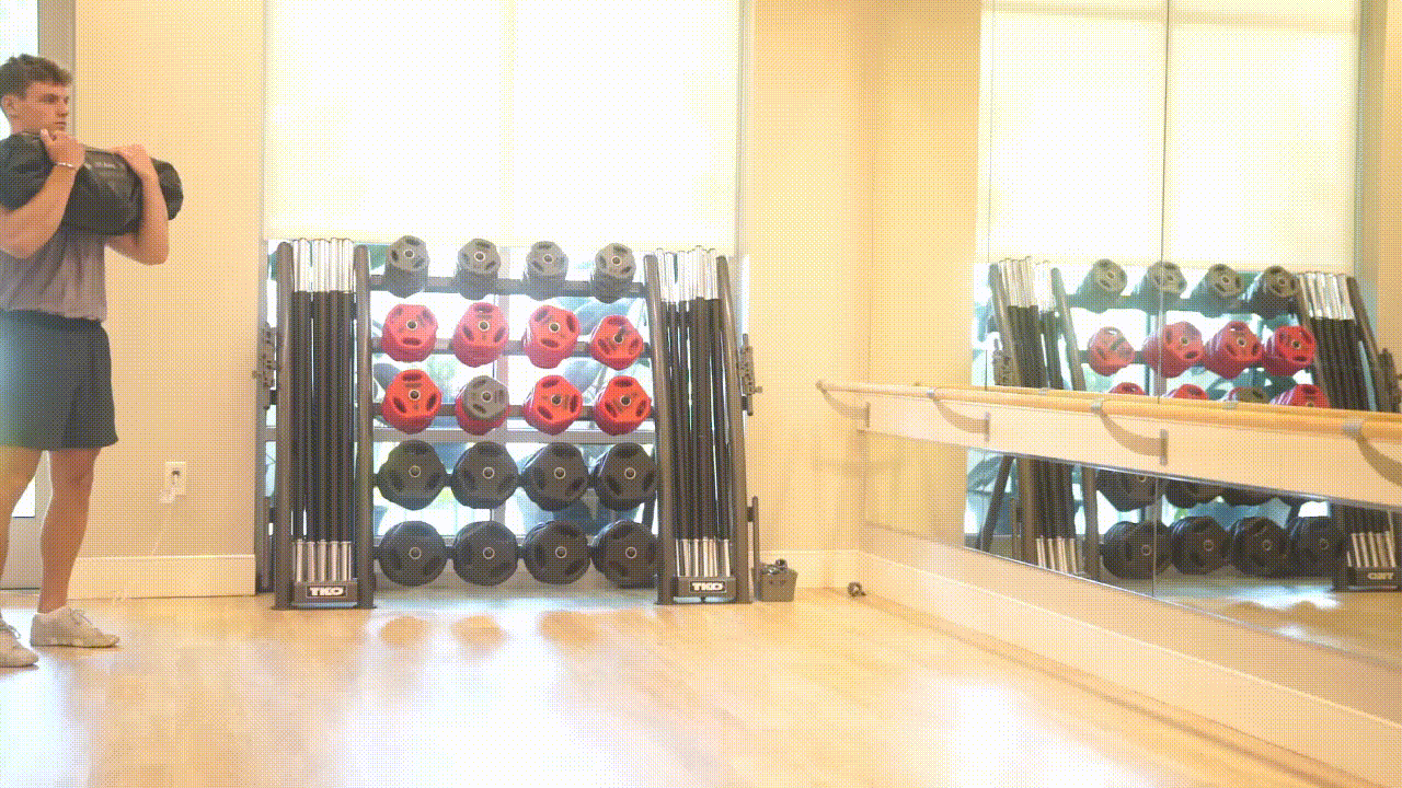 Animated demonstration of the Medicine Ball Sandbag Carry